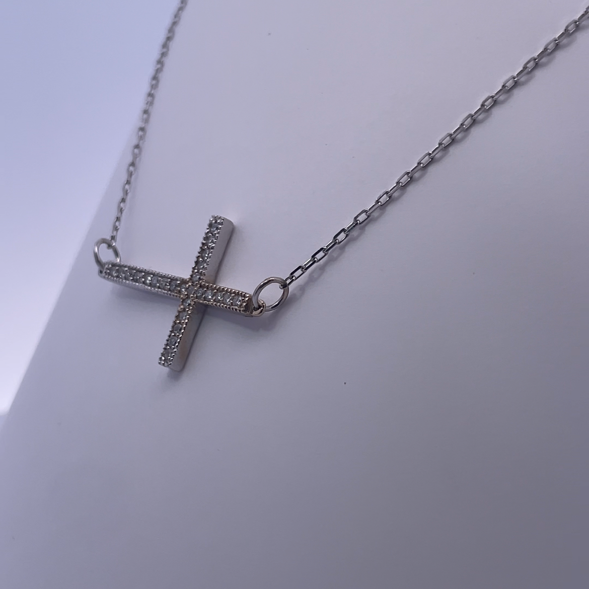 White Gold Sideways Cross Necklace – A Contemporary Take on Classic Symbolism