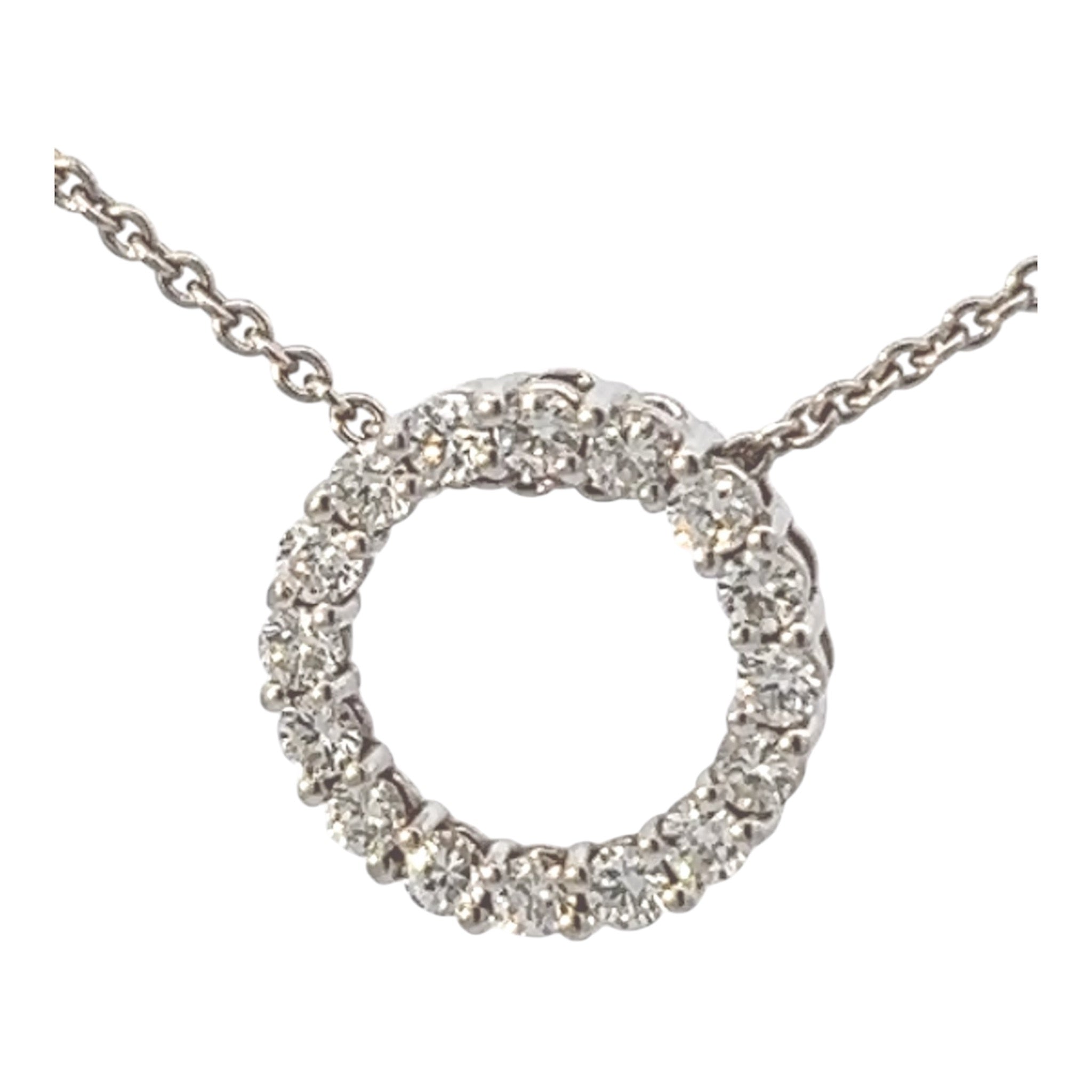 Timeless feelings. Diamond circle pendant, 18k white gold necklace.